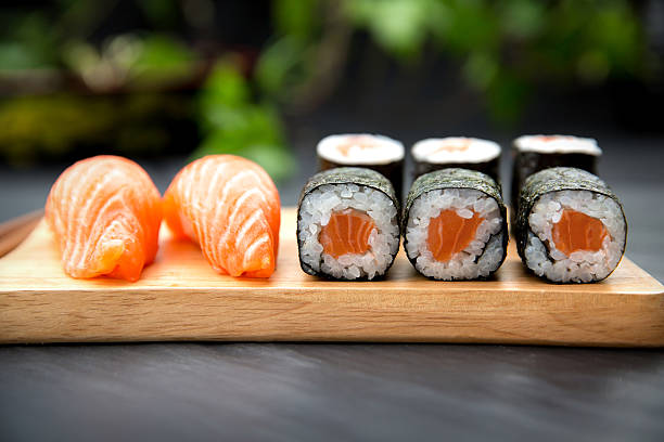 istock Sushi Nigiri with fresh salmon and Maki roll 512056596