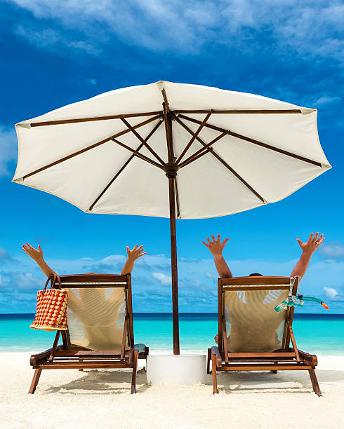 istock Couple on a tropical beach at Maldives 512058527