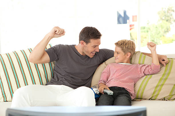 istock Watching sport on TV with Dad 512059188