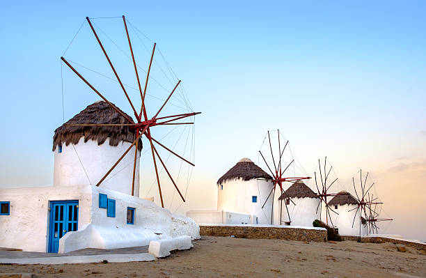 istock Traditional greek windmills on Mykonos island at sunrise, Cyclad 512059196