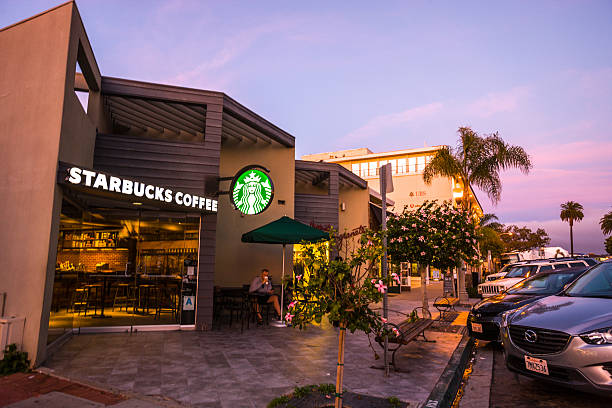 La Jolla, California, USA  - January 20, 2016: Man drinking coffee in Starbucks, La Jolla, USA
