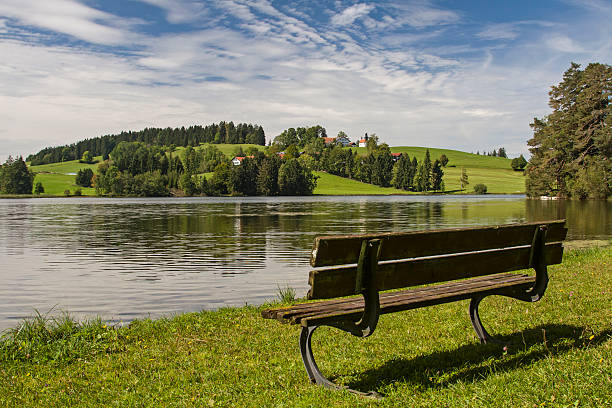 The lake Schwaltenweiher in Eastern Allgaeu is an idyllic lake storage which is used nowadays as a bathing lake and fish farming