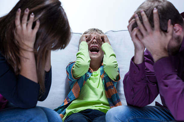 istock Screaming boy and tired parents 512060911