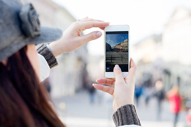 istock Woman photographing with smart phone 512061032