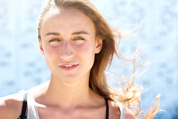 istock Beautiful young woman with hair blowing 512062039