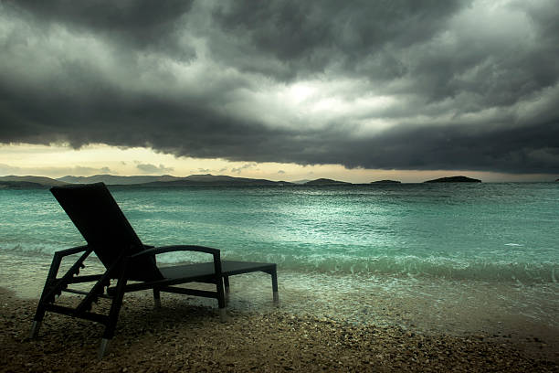 istock sun lounger on the turquoise sea under clouds 512081223