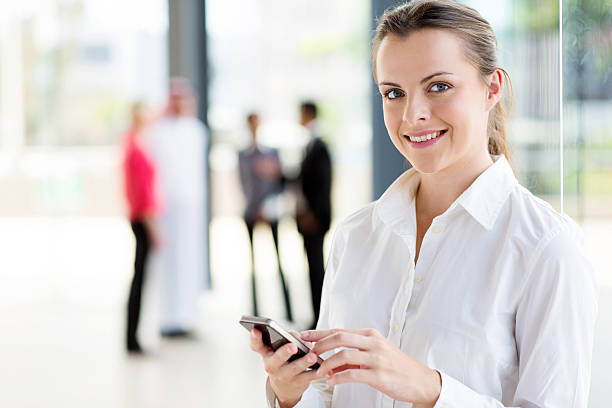 istock young career woman using cell phone 512081943