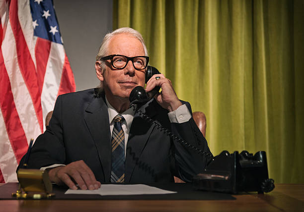 istock Big boss president wearing glasses calling behind desk. 512082229