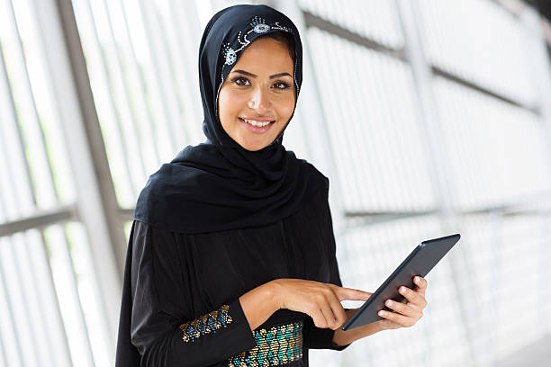 istock arabian girl with tablet computer 512083007