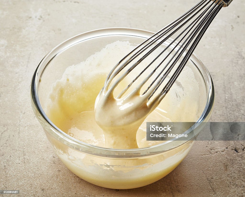 whipped egg yolk with sugar whipped egg yolks with sugar in a glass bowl Custard Stock Photo