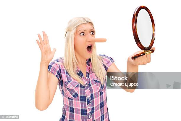 Shocked Woman Looking At Her Long Nose In A Mirror Stock Photo - Download Image Now - 20-29 Years, Adult, Adults Only