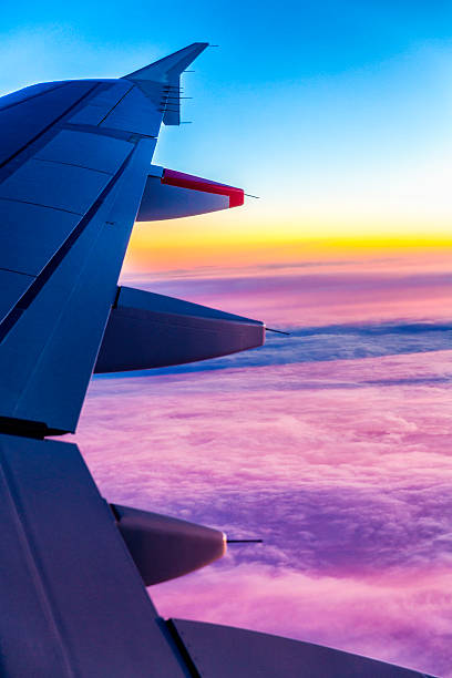 istock Classic image of wing clouds and wingtip on comercial airplane 512084955