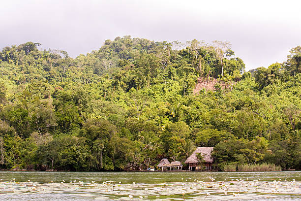 istock Village on the river before rain storm in Guatemala 512085407