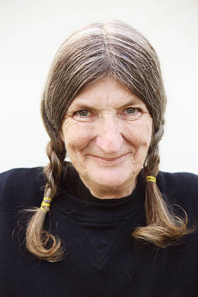 istock Happy Mature Woman on Light Background 512085469