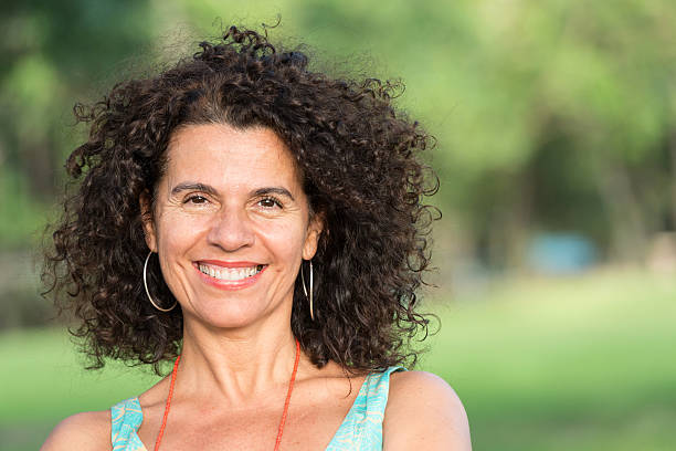 istock Smiling mature hispanic woman 512085571