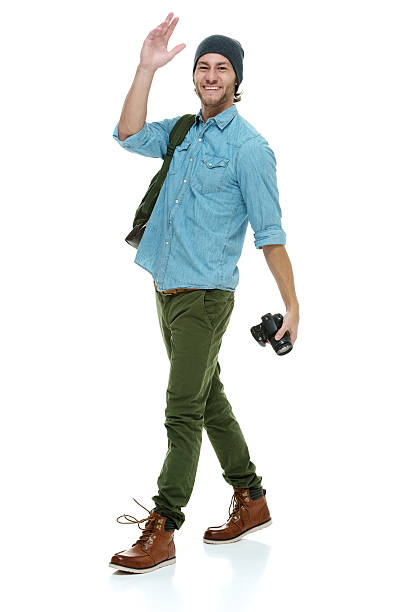 istock Happy photographer waving 512086023