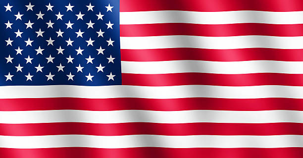 Flag of USA waving in the wind stock photo