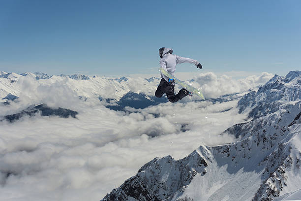 istock Flying snowboarder on mountains. Extreme sport 512094186