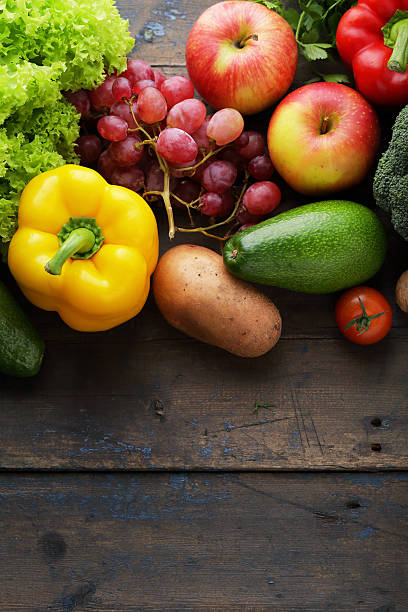 istock vegetables and fruits on boards 512094284
