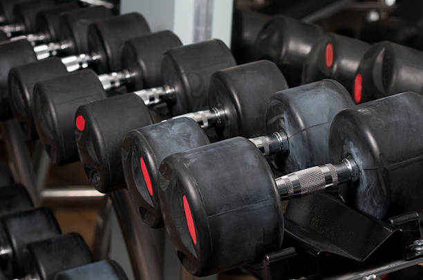 istock Dumbbells lined up in a fitness center 512096916
