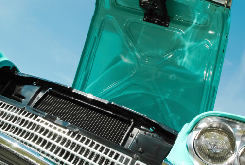 abstract of a classic car with the bonnet up