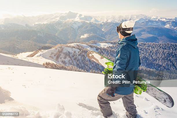 Adventure To Winter Sport Snowboarder Man Hiking At Mountain Stock Photo - Download Image Now