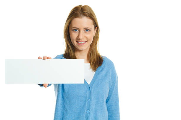 istock attractive young woman with blank ad banner 512099322