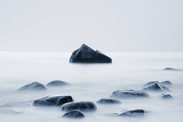 istock Sunset at coast of sea. Low shutter speed, smooth level 512100236
