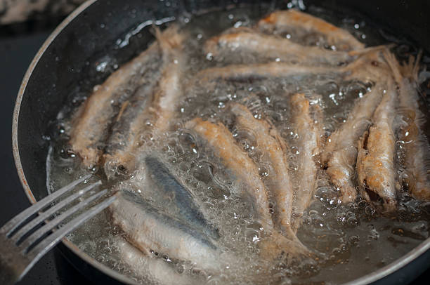 istock Frying anchovies in clusters 512100356