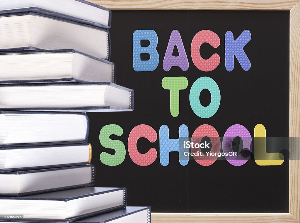 Back to school message and a stack of hardcover books Advice Stock Photo