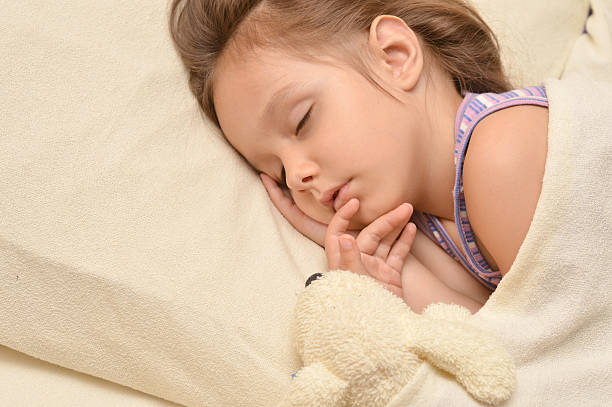 istock Little girl sleeping with  toy 512100858