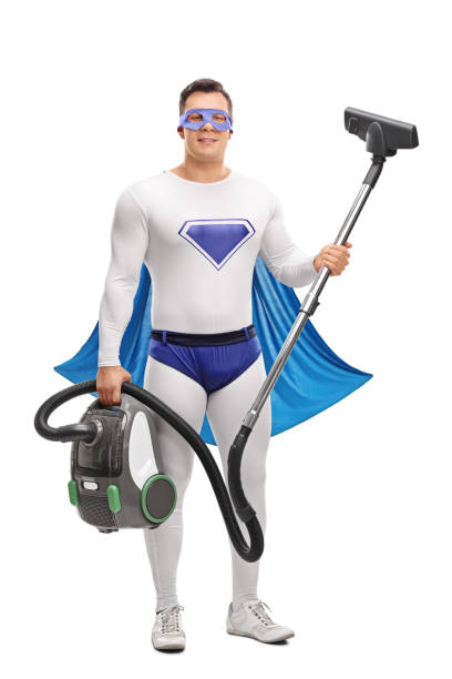 istock Young superhero holding a vacuum cleaner 512100944