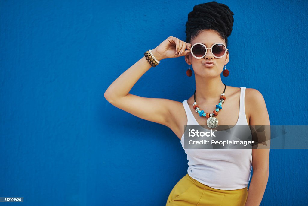 When your pout is on point Shot of an attractive young woman wearing funky sunglasses against a blue backgroundhttp://195.154.178.81/DATA/i_collage/pi/shoots/806374.jpg Fashion Stock Photo