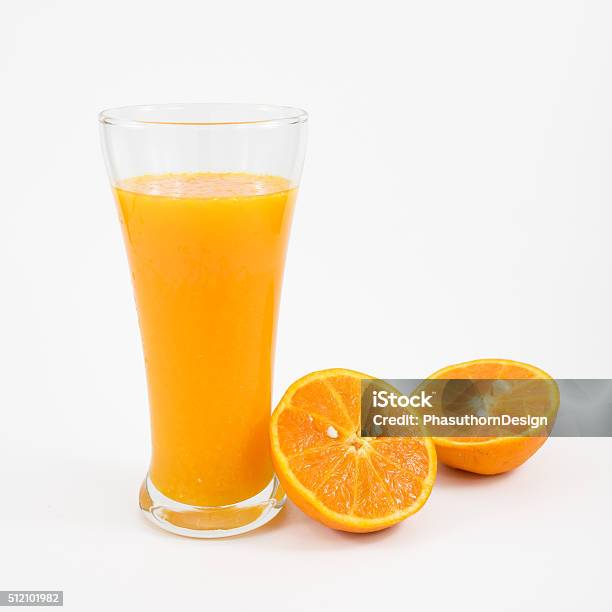 Glass Of Tasty Pure Orange Juice And Fresh Orange Half Stock Photo - Download Image Now