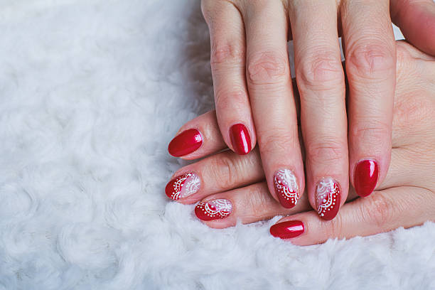 istock Red nail art with white lace with dots and lines 512104116