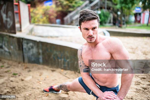 Fitness Man Stretching And Tired On The Park Stock Photo - Download Image Now - 20-29 Years, 30-39 Years, Active Lifestyle