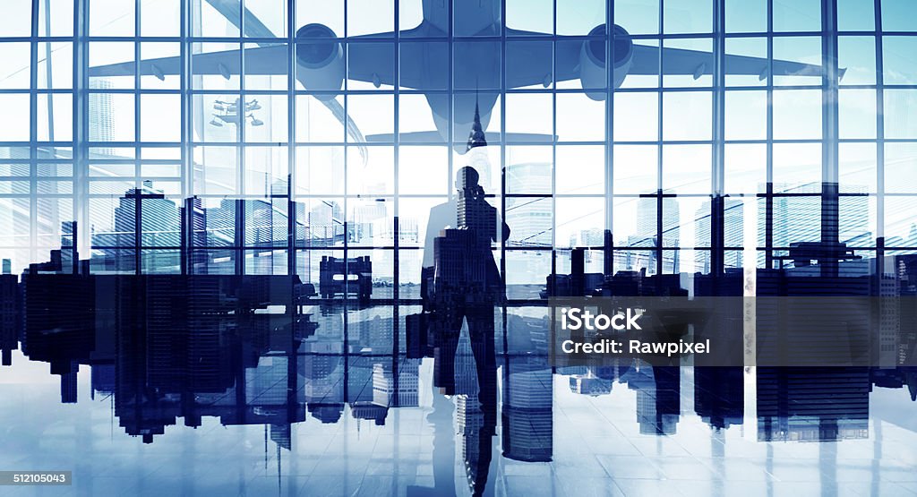 Businessman on the Phone Waiting to Travel Airplane Stock Photo