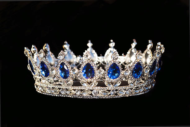 istock Royal crown with sapphire on black background 512106132