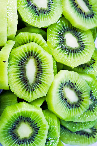 istock close up of beautiful kiwi fruit slices background 512106285