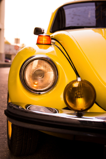 Izmir, Turkey - September 10, 2014: Yellow Volkswagen beetles headlight. Izmir Turkey 10 September.The Volkswagen Beetle, was an economy car produced by the German auto maker company Volkswagen.