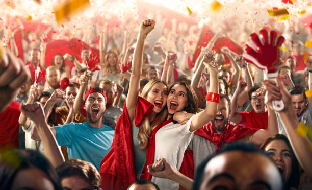istock Sport fans: Two girls embrace each other 512107696