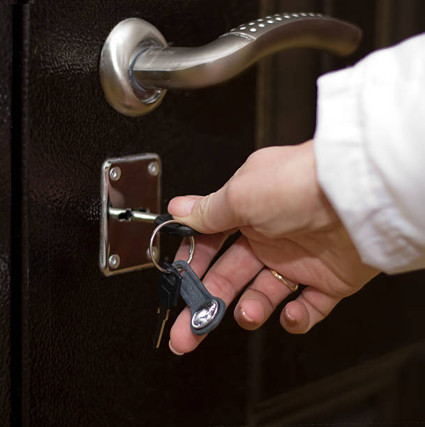 istock The woman opens the door with a key 512109246