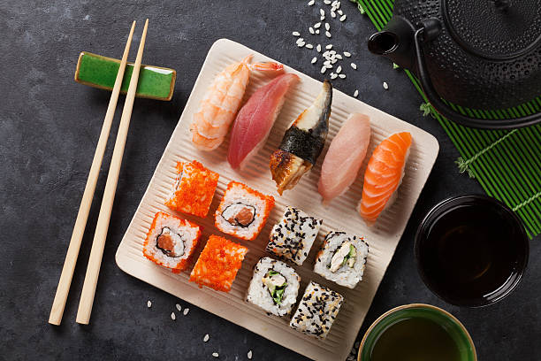 istock Set of sushi and maki roll and green tea 512109986