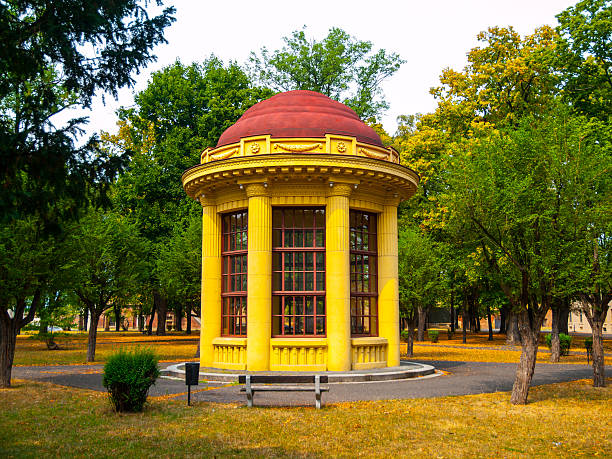 Park gazebo with red roof and yellow facade, Terezin, Czech Republic