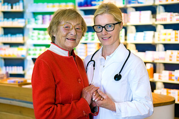 istock Happy doctor with female patient in pharmacy. 512110852