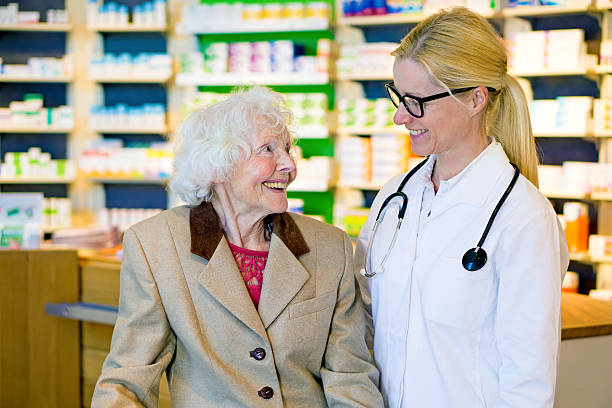 istock Elderly patient happy with her smiling doctor. 512111320