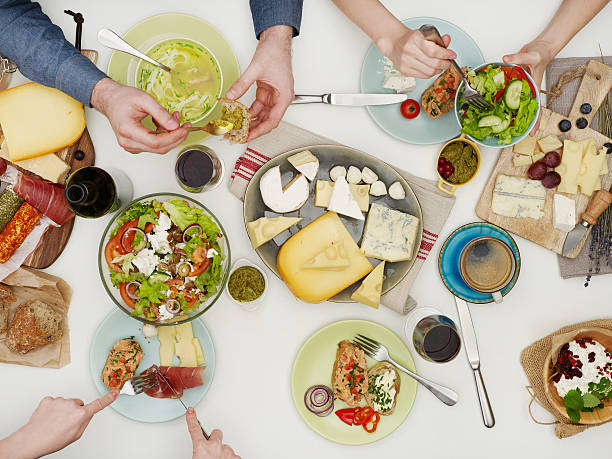 istock View from above of friends having dinner 512114372