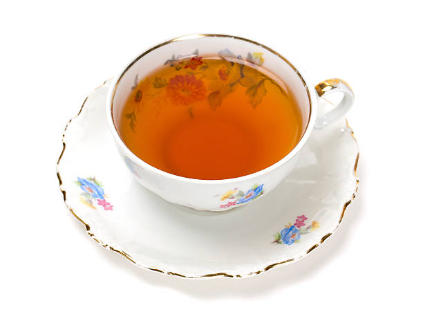 istock tea in vintage cup isolated on white 512116304