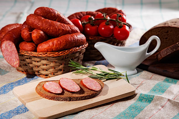 sausage still life with sliced sausage and bread inlay stock pictures, royalty-free photos & images