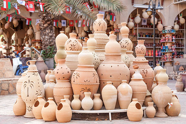 Terracotta pots for sale in Nizwa, Oman Terracotta pots for sale in Nizwa souk. Sultanate of Oman, Middle East adobe material photos stock pictures, royalty-free photos & images